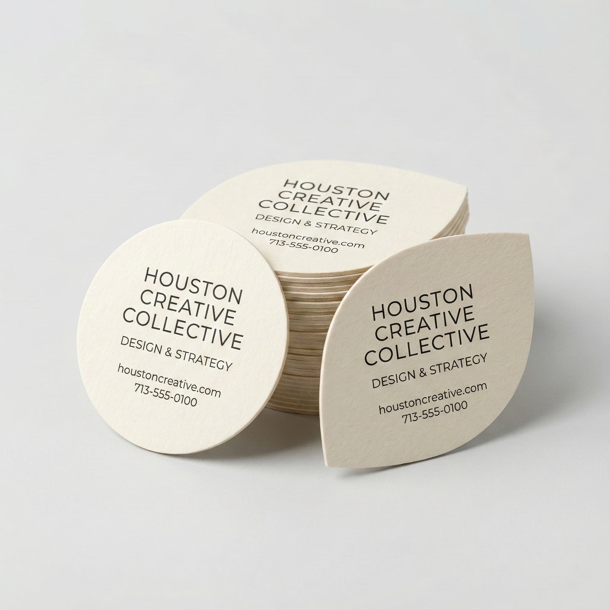 Custom die‑cut shaped business cards printed on 16pt cardstock for Houston creative and boutique brands
